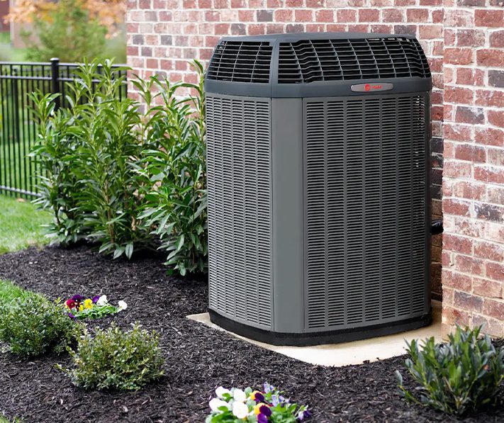 Outdoor air conditioning unit beside house