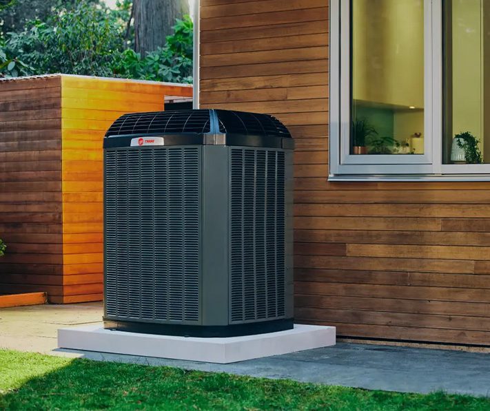 Modern AC unit next to window